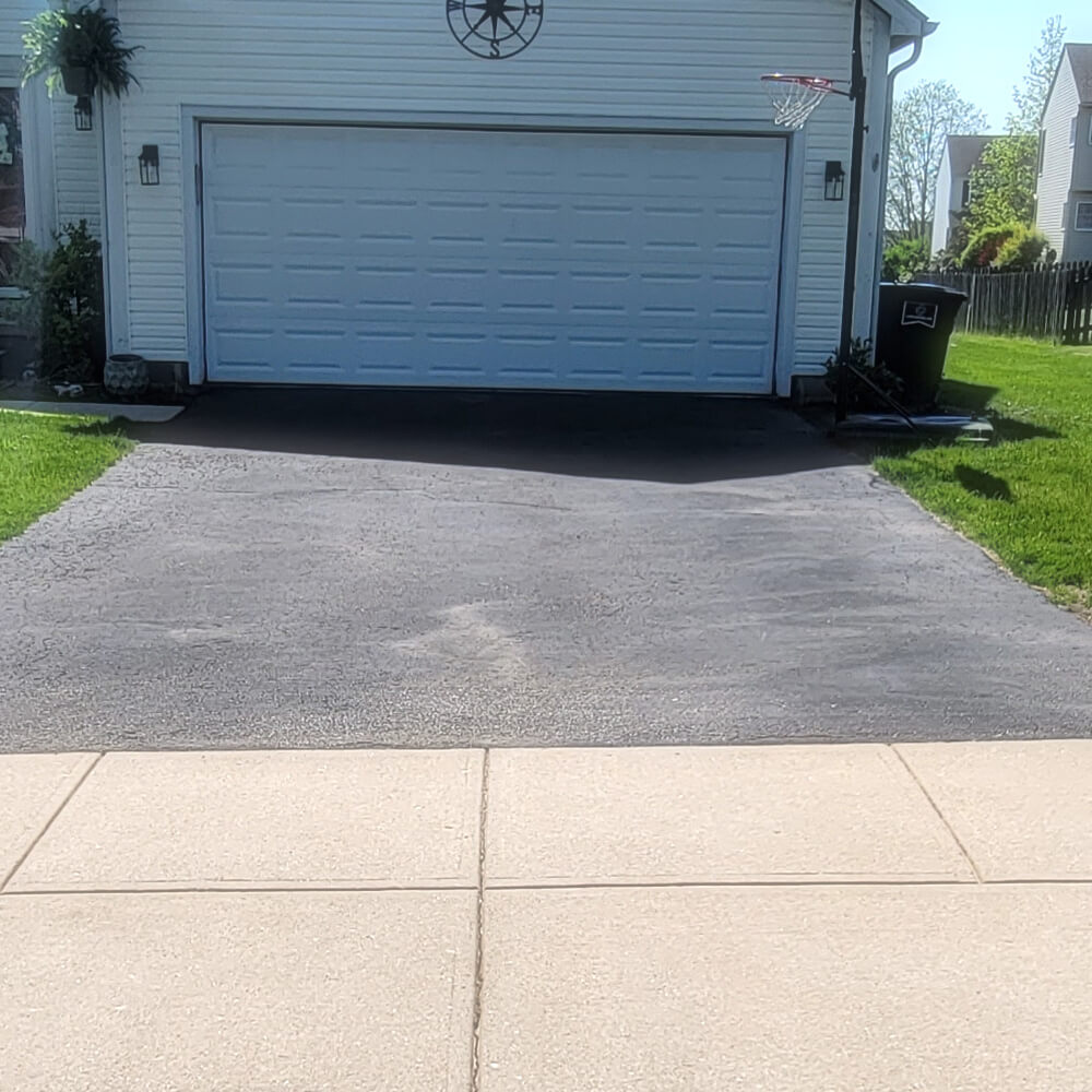 Driveway before pressure washing